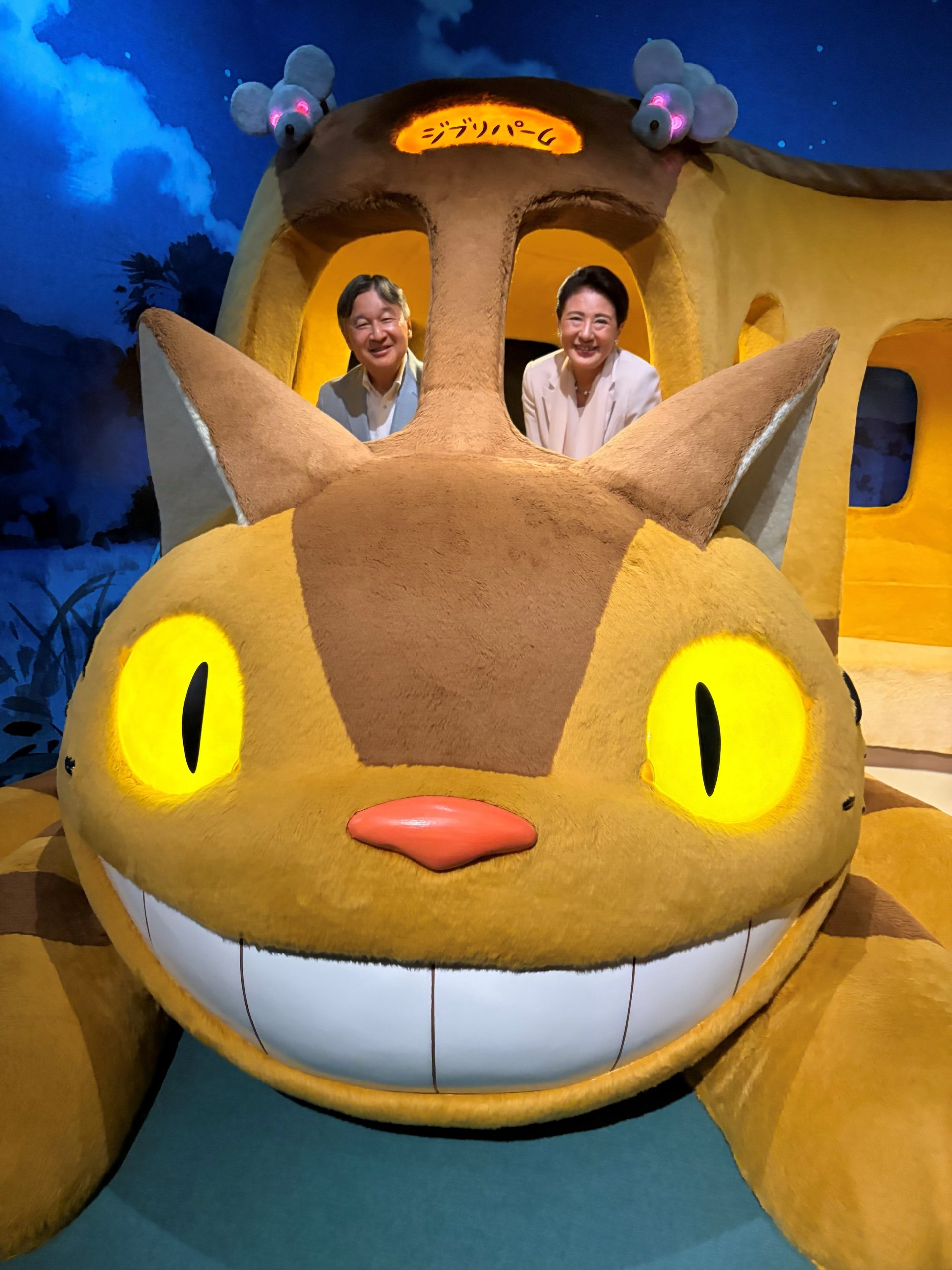 Emperor Naruhito and Empress Masako beaming inside the giant Catbus (Nekobus) from My Neighbor Totoro at Ghibli Park, Aichi - Photo: @kunaicho_jp